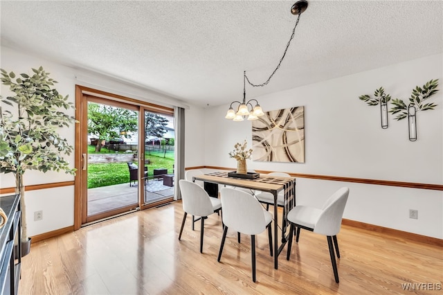 94 N Seine Dr, Cheektowaga, NY 14227 - dining room with a textured ceiling, light wood-style flooring, and a chandelier