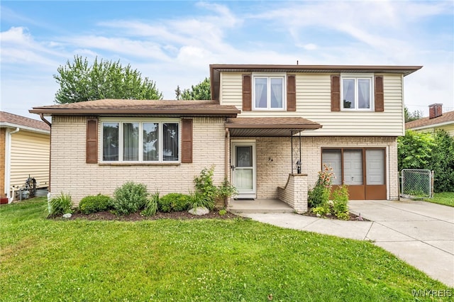 94 N Seine Dr, Cheektowaga, NY 14227 - tri-level home featuring driveway, an attached garage, a front yard, and brick siding