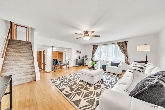94 N Seine Dr, Cheektowaga, NY 14227 - living area featuring stairway, light wood-style flooring, and ceiling fan