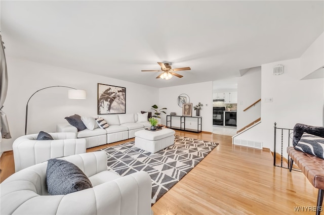 94 N Seine Dr, Cheektowaga, NY 14227 - living area featuring light wood finished floors and a ceiling fan