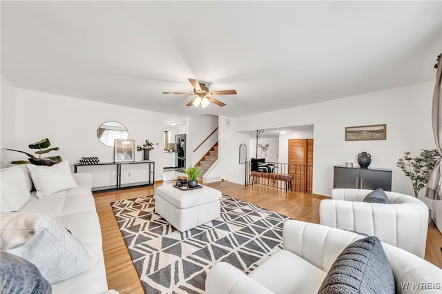 94 N Seine Dr, Cheektowaga, NY 14227 - living area with stairs, light wood finished floors, and ceiling fan