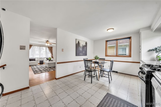 94 N Seine Dr, Cheektowaga, NY 14227 - dining room featuring a ceiling fan and light floors