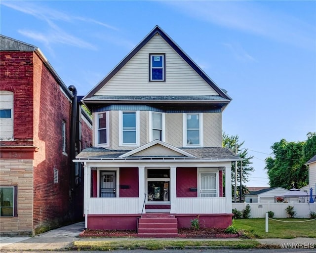 1329 Clinton St, Buffalo, NY 14206 - view of front of home featuring covered porch and roof with shingles