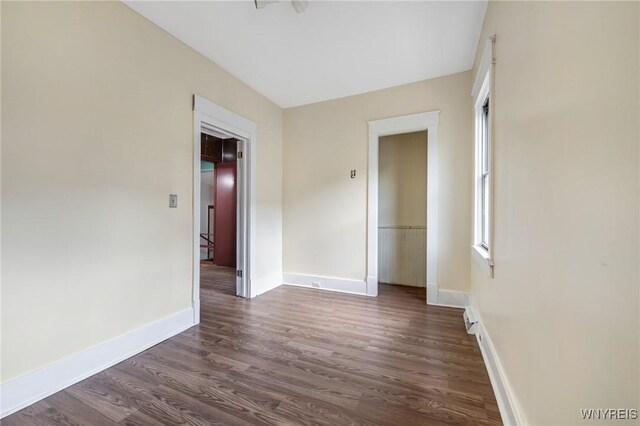 1329 Clinton St, Buffalo, NY 14206 - empty room featuring dark wood finished floors and baseboards