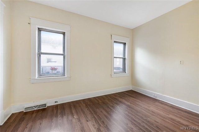 1329 Clinton St, Buffalo, NY 14206 - empty room featuring plenty of natural light and dark wood-type flooring
