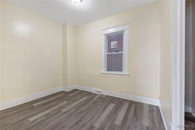 1329 Clinton St, Buffalo, NY 14206 - spare room featuring dark wood-style flooring and baseboards