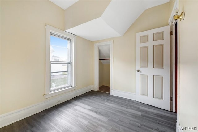 1329 Clinton St, Buffalo, NY 14206 - unfurnished bedroom featuring wood finished floors, vaulted ceiling, and a closet