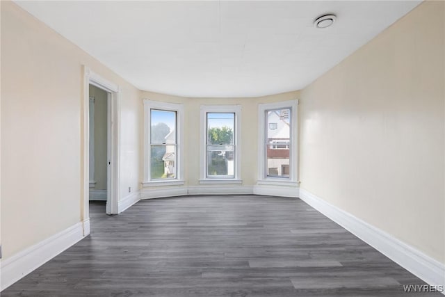 1329 Clinton St, Buffalo, NY 14206 - empty room featuring baseboards and dark wood-style flooring