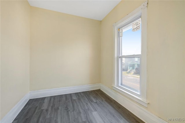 1329 Clinton St, Buffalo, NY 14206 - spare room featuring baseboards and dark wood-type flooring
