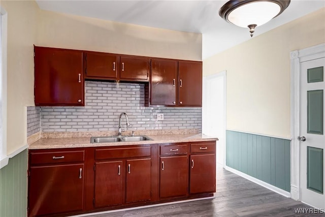 1329 Clinton St, Buffalo, NY 14206 - kitchen featuring light countertops, wainscoting, dark wood-type flooring, and backsplash