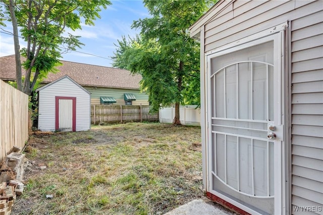 1329 Clinton St, Buffalo, NY 14206 - fenced backyard featuring a storage unit