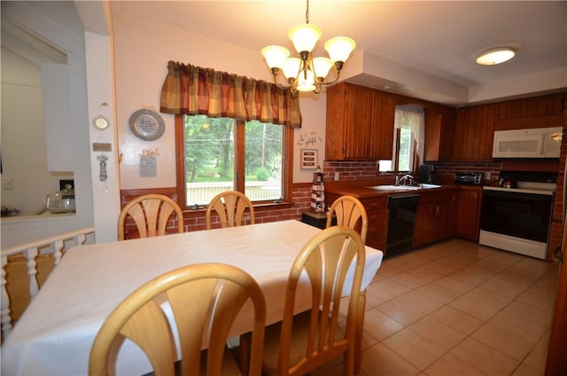 162 Miramar Rd, Gates, NY 14624 - dining room with a chandelier and light tile patterned floors