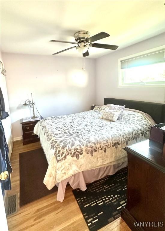 93 Century Dr, West Seneca, NY 14224 - bedroom featuring wood finished floors and a ceiling fan