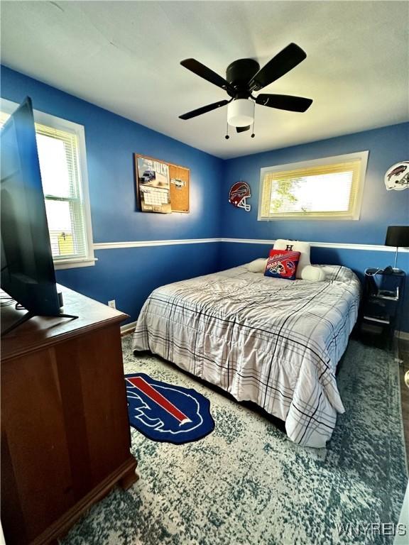 93 Century Dr, West Seneca, NY 14224 - bedroom with multiple windows, carpet floors, and ceiling fan
