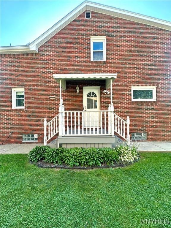 93 Century Dr, West Seneca, NY 14224 - rear view of property featuring brick siding and a yard