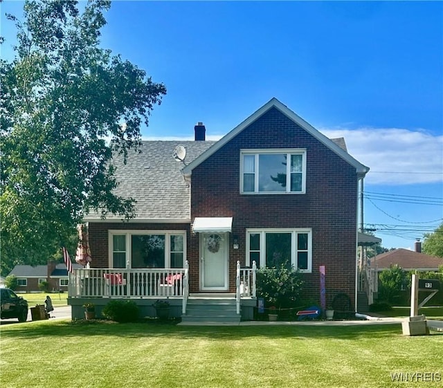 93 Century Dr, West Seneca, NY 14224 - traditional-style home featuring brick siding, a front lawn, and a chimney