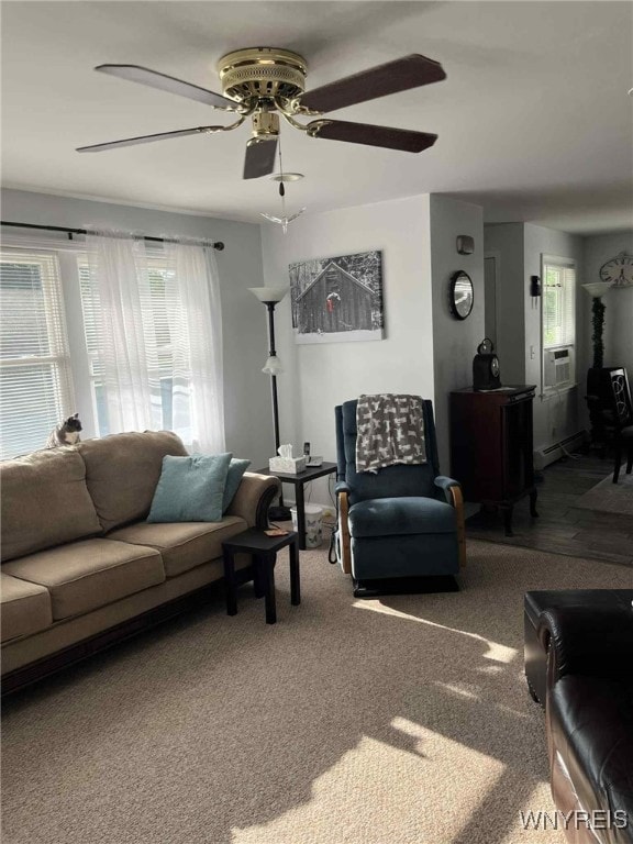 120 Park Lane Cir, Lockport City, NY 14094 - carpeted living room featuring healthy amount of natural light, a ceiling fan, a wood stove, and cooling unit