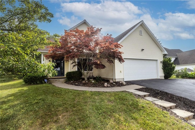 203 Upland Run, Horseheads, NY 14845 - obstructed view of property with driveway, a front lawn, and an attached garage
