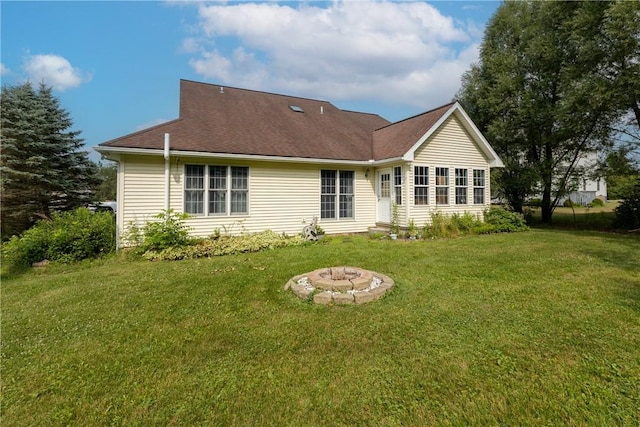 203 Upland Run, Horseheads, NY 14845 - rear view of house with a lawn and an outdoor fire pit