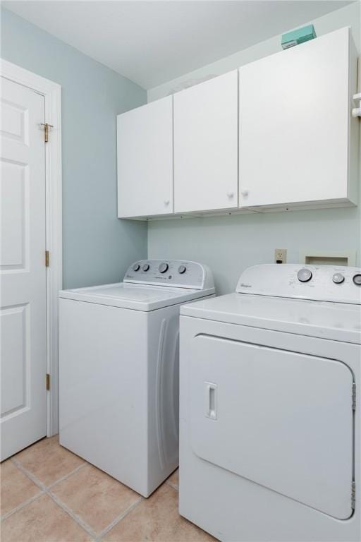203 Upland Run, Horseheads, NY 14845 - laundry area with separate washer and dryer, cabinet space, and light tile patterned floors