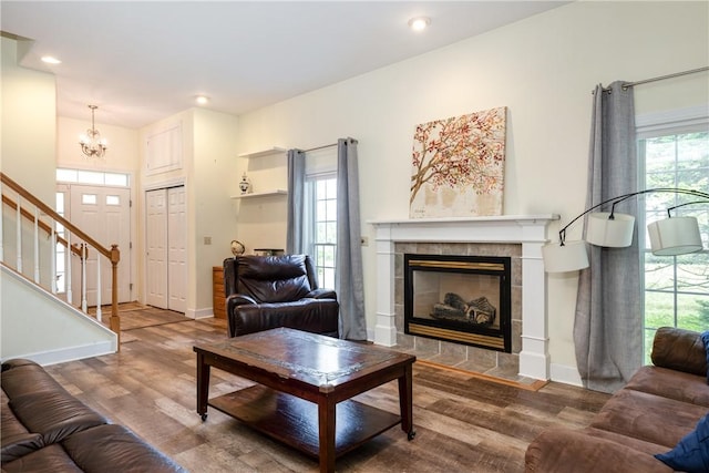 203 Upland Run, Horseheads, NY 14845 - living area featuring wood finished floors, a chandelier, stairway, a fireplace, and recessed lighting