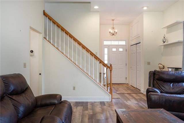203 Upland Run, Horseheads, NY 14845 - living room featuring a chandelier, wood finished floors, stairway, and recessed lighting