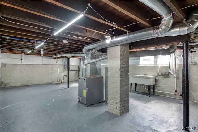 40 Decker St, Buffalo, NY 14215 - basement with heating unit and a sink