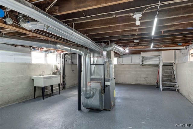 40 Decker St, Buffalo, NY 14215 - basement with heating unit and a sink