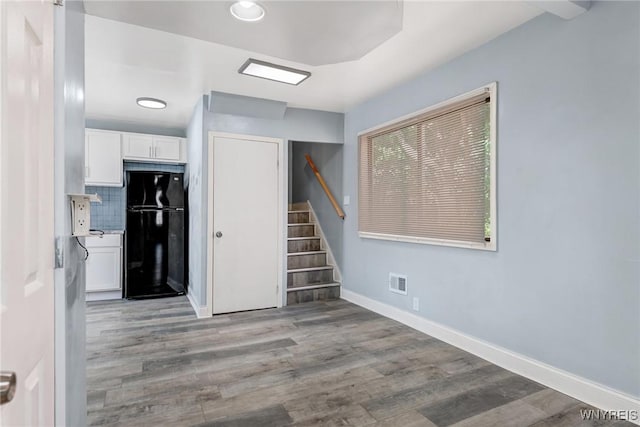 40 Decker St, Buffalo, NY 14215 - unfurnished room featuring stairs and wood finished floors