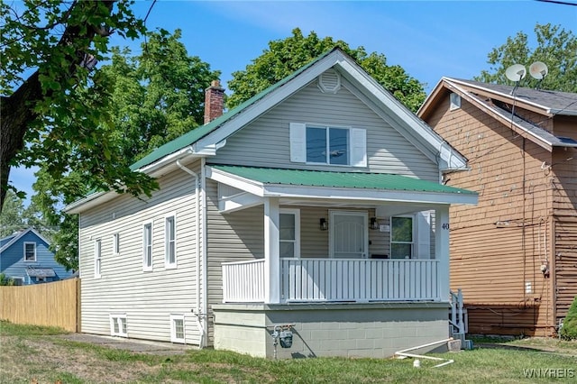40 Decker St, Buffalo, NY 14215 - view of front of home featuring a porch, a chimney, and a metal roof