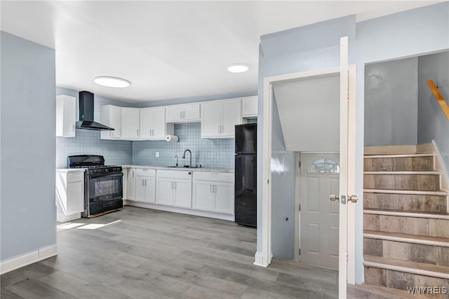 40 Decker St, Buffalo, NY 14215 - kitchen featuring black appliances, wall chimney exhaust hood, white cabinetry, light countertops, and tasteful backsplash