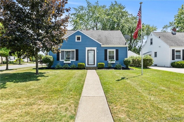 715 Brighton Rd, Tonawanda, NY 14150 - bungalow-style home with a front yard and a shingled roof