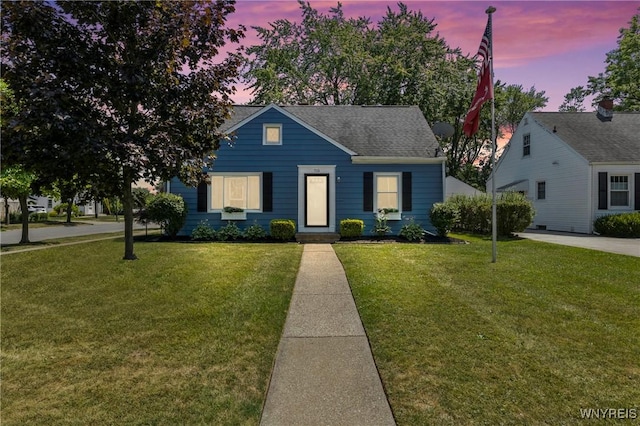 715 Brighton Rd, Tonawanda, NY 14150 - view of front facade with a front lawn and roof with shingles