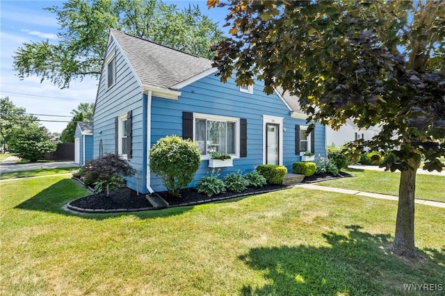 715 Brighton Rd, Tonawanda, NY 14150 - view of front of home featuring a front yard and roof with shingles