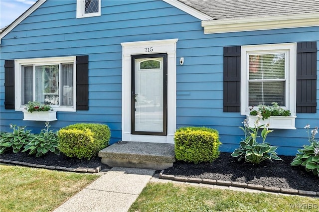 715 Brighton Rd, Tonawanda, NY 14150 - view of exterior entry featuring a shingled roof