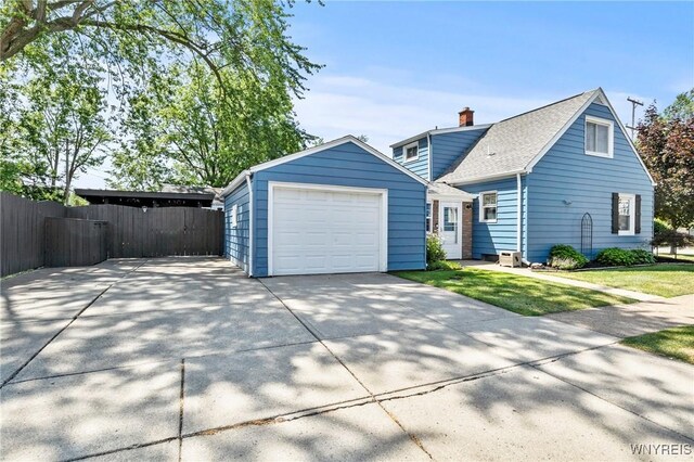 715 Brighton Rd, Tonawanda, NY 14150 - view of front of property with concrete driveway and roof with shingles
