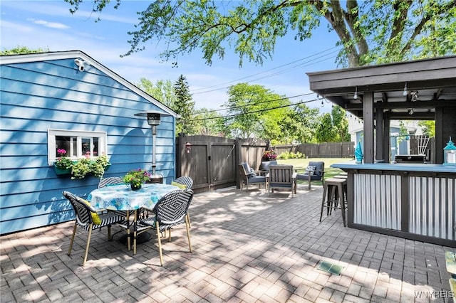 715 Brighton Rd, Tonawanda, NY 14150 - fenced backyard featuring a patio, a gate, and outdoor dining area