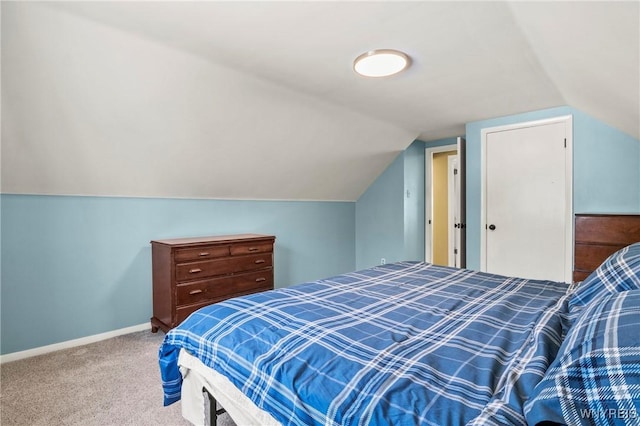 715 Brighton Rd, Tonawanda, NY 14150 - carpeted bedroom with vaulted ceiling and baseboards
