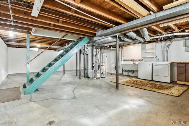 715 Brighton Rd, Tonawanda, NY 14150 - unfinished basement with washer and clothes dryer, stairway, and heating unit