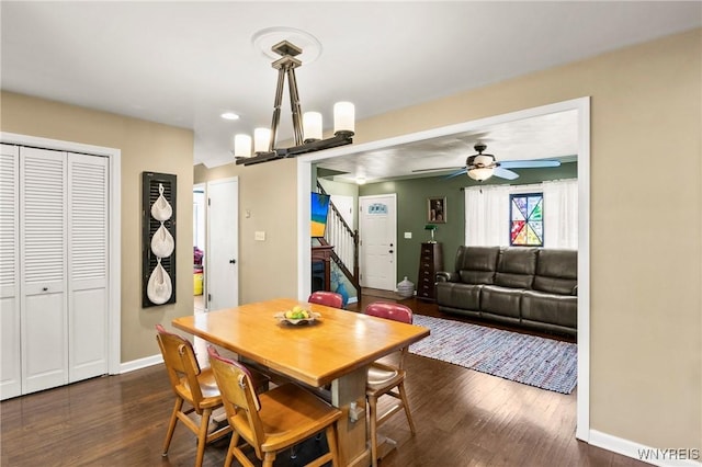 715 Brighton Rd, Tonawanda, NY 14150 - dining space featuring a barn door, stairs, dark wood-type flooring, a ceiling fan, and recessed lighting