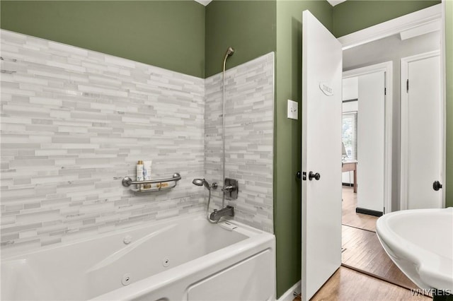 715 Brighton Rd, Tonawanda, NY 14150 - full bathroom featuring a combined bath / shower with jetted tub and wood finished floors