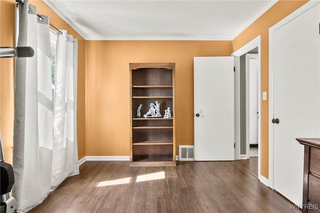 715 Brighton Rd, Tonawanda, NY 14150 - unfurnished bedroom featuring wood finished floors and crown molding