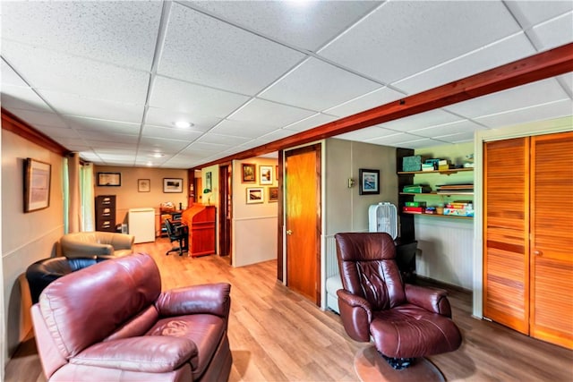 61 Country Pl, Colesville, NY 13813 - living room featuring wood finished floors, a desk, and a drop ceiling