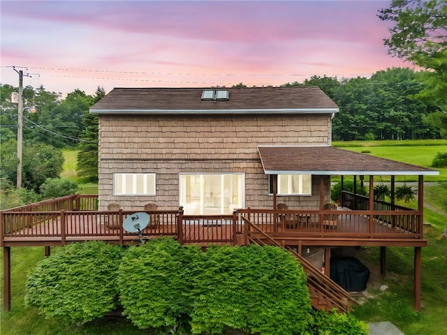61 Country Pl, Colesville, NY 13813 - back of property at dusk featuring a wooden deck, a shingled roof, and stairway