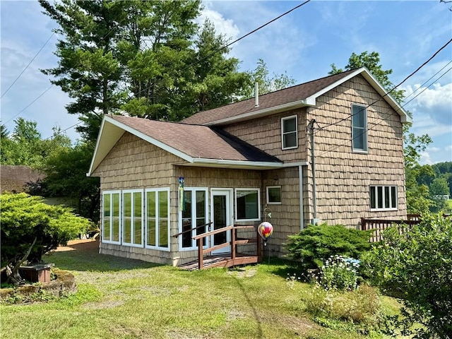61 Country Pl, Colesville, NY 13813 - rear view of property featuring a sunroom, a lawn, and roof with shingles