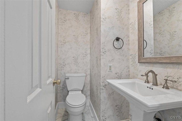 16 Onondaga St, Skaneateles, NY 13152 - bathroom featuring toilet and baseboards