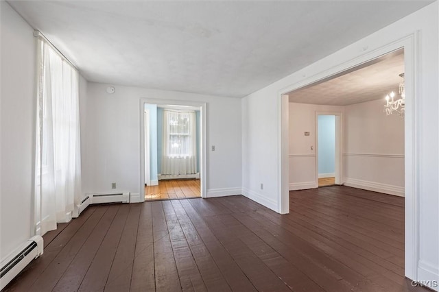 16 Onondaga St, Skaneateles, NY 13152 - empty room with a baseboard heating unit, a chandelier, and dark wood-type flooring