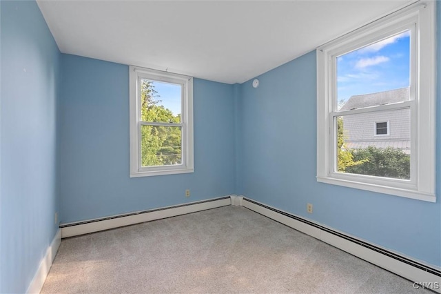 16 Onondaga St, Skaneateles, NY 13152 - empty room with baseboard heating, plenty of natural light, and carpet