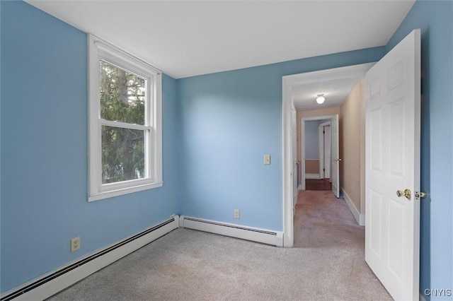 16 Onondaga St, Skaneateles, NY 13152 - carpeted empty room with a baseboard radiator