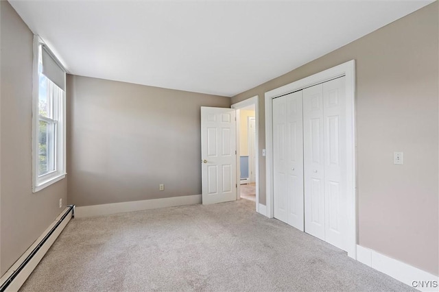 16 Onondaga St, Skaneateles, NY 13152 - unfurnished bedroom with baseboard heating, carpet floors, and a closet